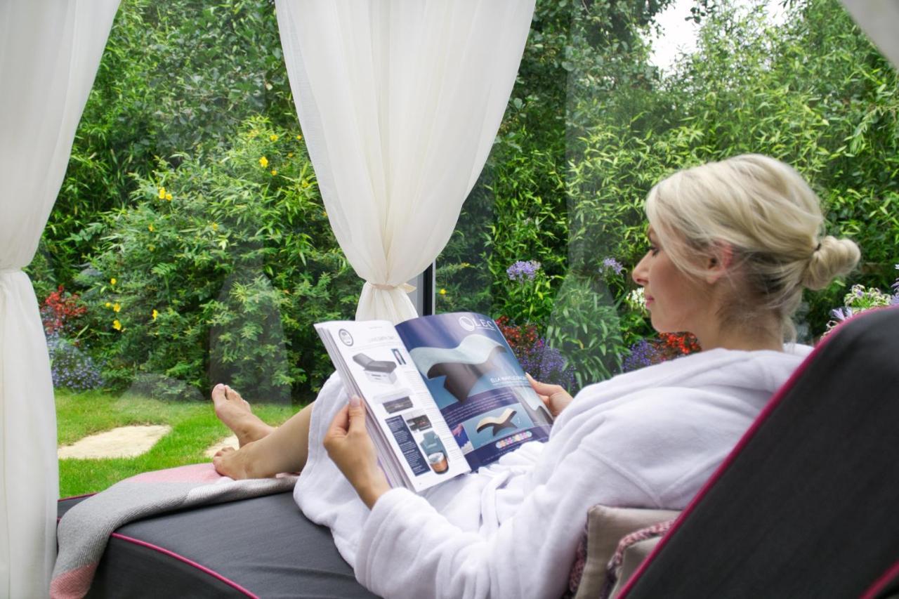 Muckross Park Hotel & Spa Kilclogherane Exterior photo A woman relaxing in a garden